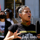 In this Aug. 5, 2020 file photo, Melina Abdullah speaks during a Black Lives Matter protest at the Hall of Justice in downtown Los Angeles. Authorities say three teenagers driven by racial hatred were behind hoax calls that brought major police responses to the home of Abdullah, a leading Black Lives Matter activist in Los Angeles.